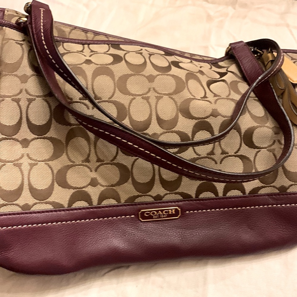 Coach monogram handbag with burgundy leather trim